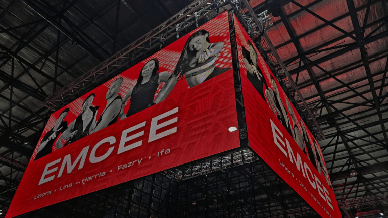 Image features a Transparent LED Screen Display which is hung above an event. The display maximizes visibility from all 4 angles to give a grand exposure of the brand and messages.