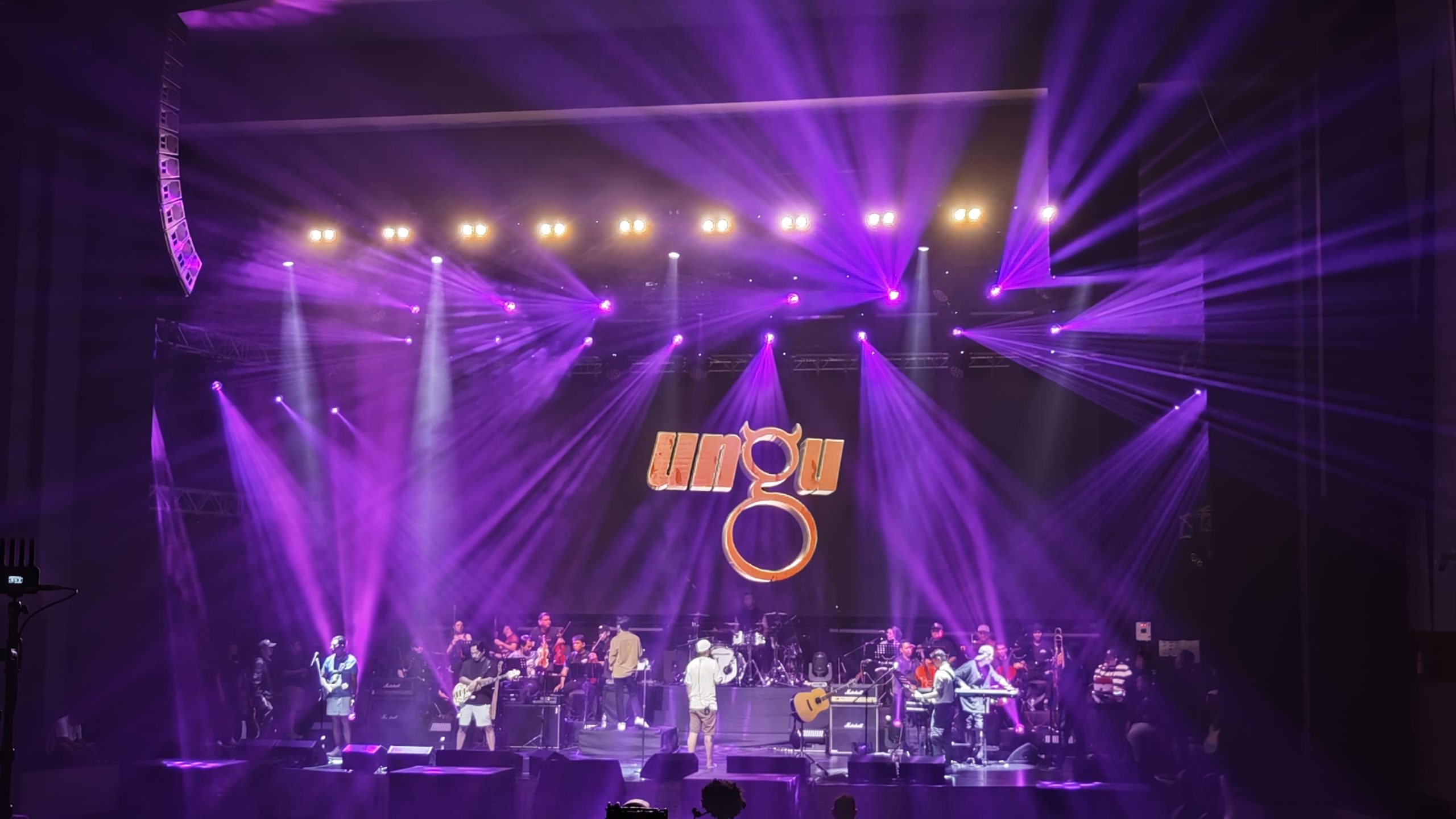 Concert stage rental setup with truss, LED screens, lighting and sound equipment