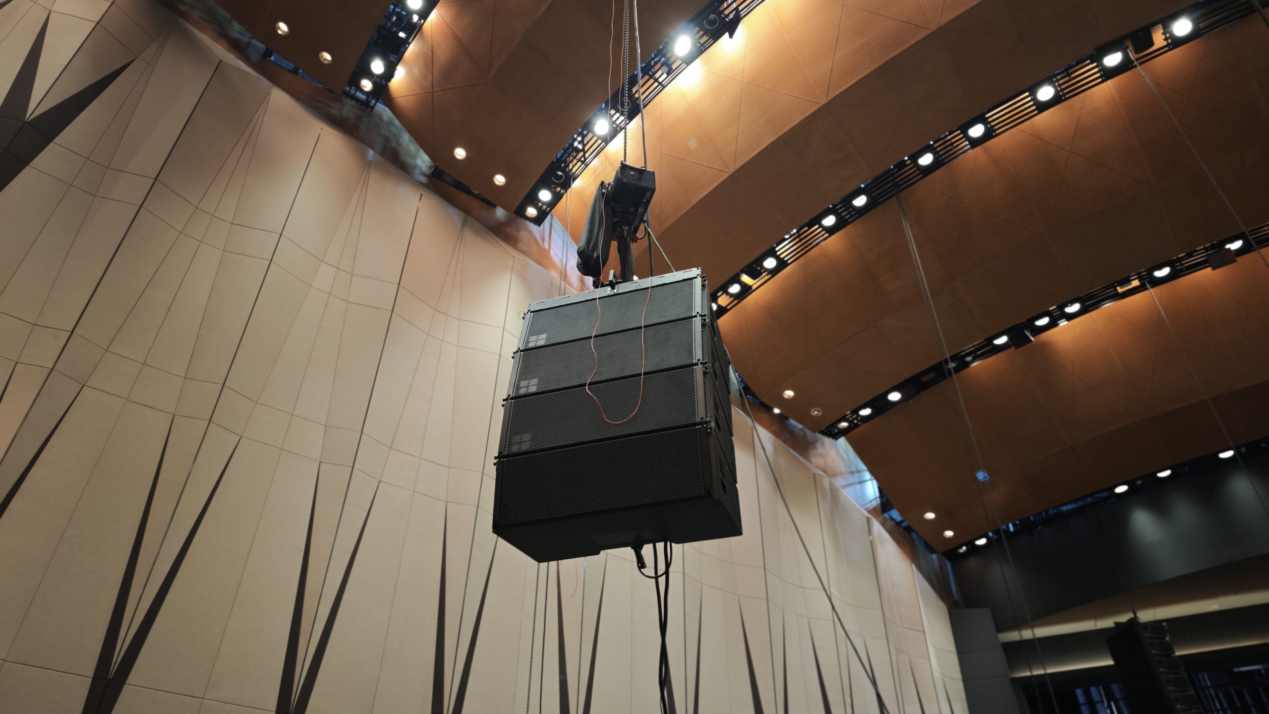 Sound system rental setup with speakers and microphones for an event